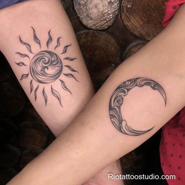 Matching sun and moon tattoo textured swirl sun crescent stars forearms, celestial sun and moon tattoo