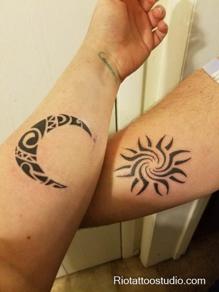 Matching sun and moon tattoo tribal patterned crescent sun forearms black ink, traditional sun and moon tattoo