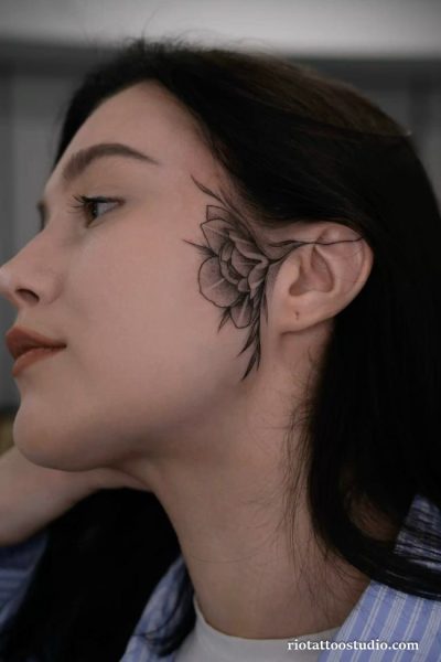 Large rose ear tattoos behind the ear and side of neck on a woman, elegant ear tattoos ideas