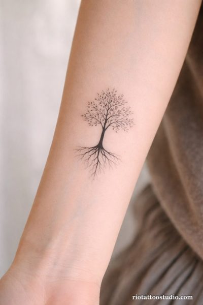Meaning of tree of life tattoo and the delicate specialty of fineline tattoos on the back.