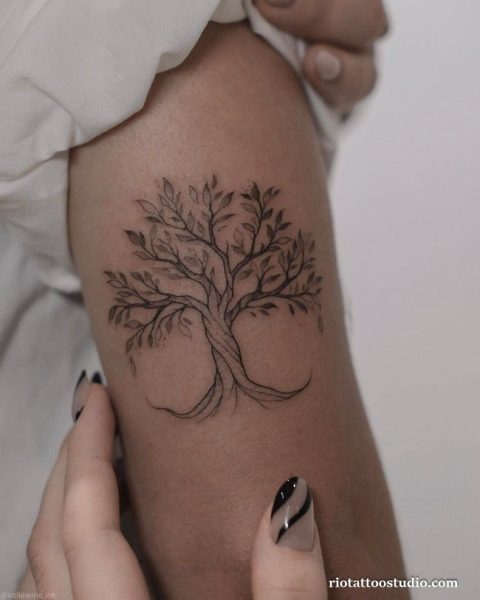 Meaning of tree of life tattoo with leaves and the delicate specialty of fineline tattoos.