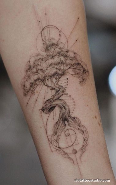 Fine line tree tattoo with sacred geometry, circles and flowing branches on forearm, delicate tree tattoo ideas