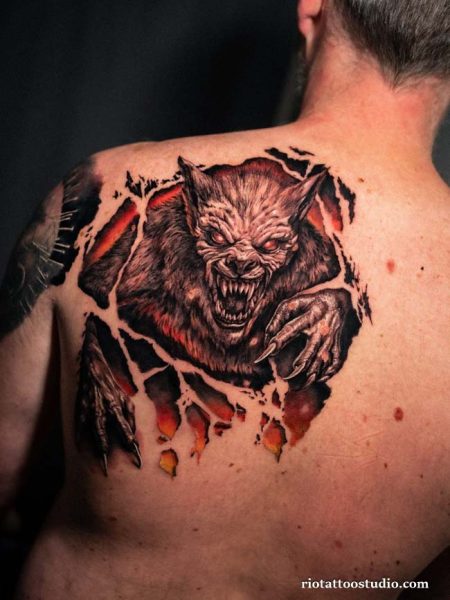 Werewolf tattoo back piece tearing skin snarling beast realistic red glow, epic werewolf tattoo
