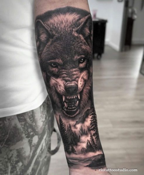 Roaring wolf forest sleeve forearm tattoo realistic landscape, fierce wolf tattoo