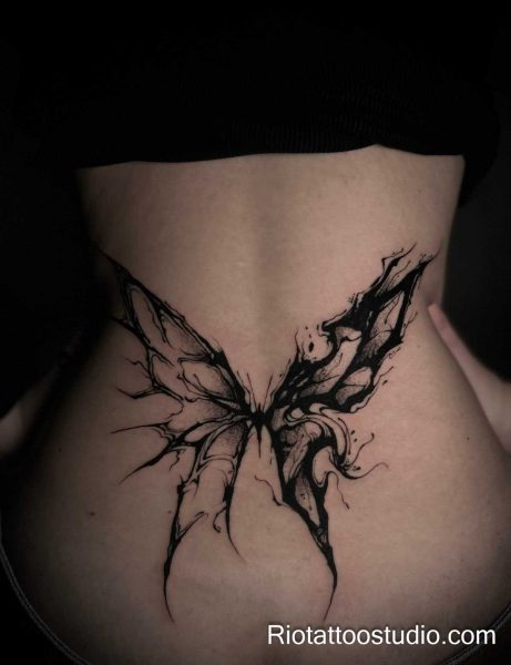Womb tattoo black butterfly wings abstract lower back, artistic womb tattoo ideas