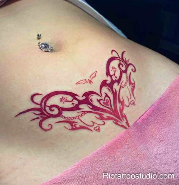 Womb tattoo red ornamental swirls hearts birds lower stomach, elegant womb tattoo ideas