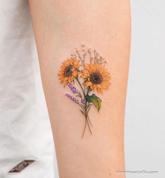 Colorful birth flower tattoo with two sunflowers and lavender on forearm, vibrant birth flower tattoo ideas