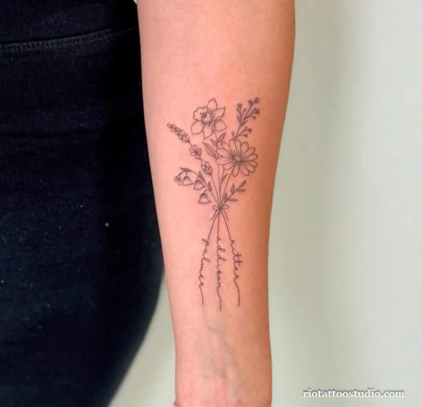 Minimalist birth flower tattoo bouquet with daffodil, daisy and lily of the valley tied with ribbon on forearm