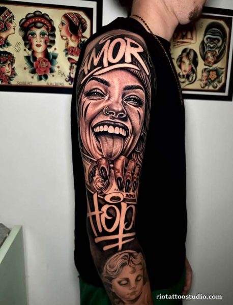 Chicano tattoo on upper arm with laughing woman sticking tongue out, AMOR and Hop text, realistic black and grey chicano tattoo