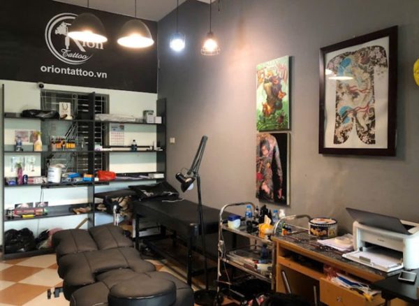 Interior of Orion Tattoo studio in Hanoi with clean tattoo beds, equipment, and professional setup for coverups tattoo sessions