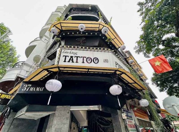 Exterior of 1984 Tattoo Studio in Hanoi with prominent signage for tattoo and piercing services, ideal location for professional coverups tattoo