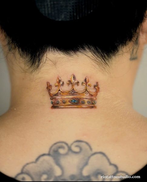 Colorful royal crown tattoo on the back of the neck, bold neck crown tattoo ideas