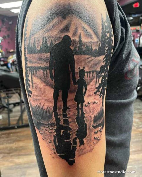 Silhouette dad daughter tattoo of father and daughter walking together by a lake with mountain reflection