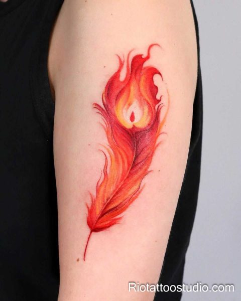Red and orange fiery feather tattoo on upper arm, phoenix style feather tattoo ideas