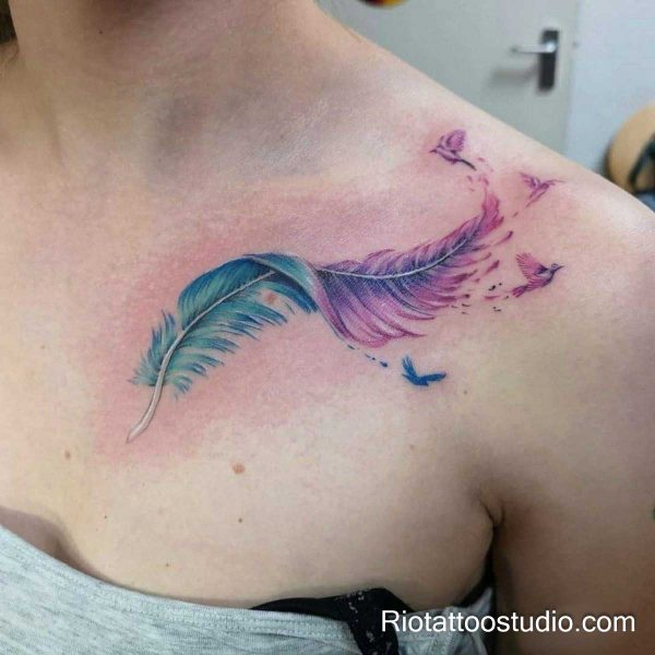 Purple and teal feather tattoo with birds on shoulder and collarbone, dreamcatcher style feather tattoo ideas
