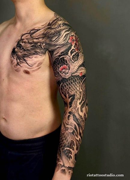 Detailed black and grey Japanese dragon tattoo sleeve with clouds and flowers from chest to arm, japanese dragon tattoo ideas