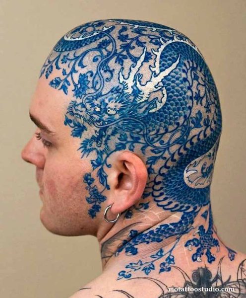 Bold blue Japanese dragon head tattoo covering the scalp, side of head and neck in traditional style, japanese dragon tattoo ideas