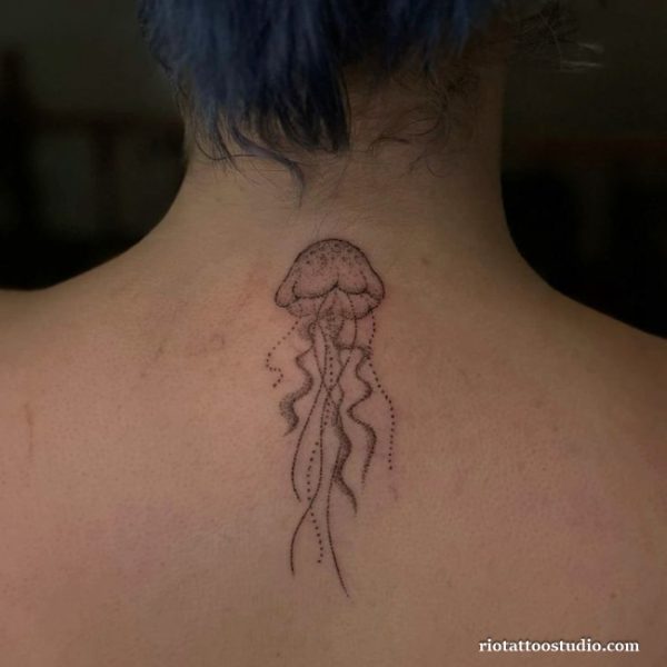 Dotwork jellyfish tattoo with dotted tentacles on the back of the neck, jellyfish tattoo ideas