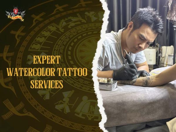 Professional artist creating water paint tattoo with detailed watercolor technique