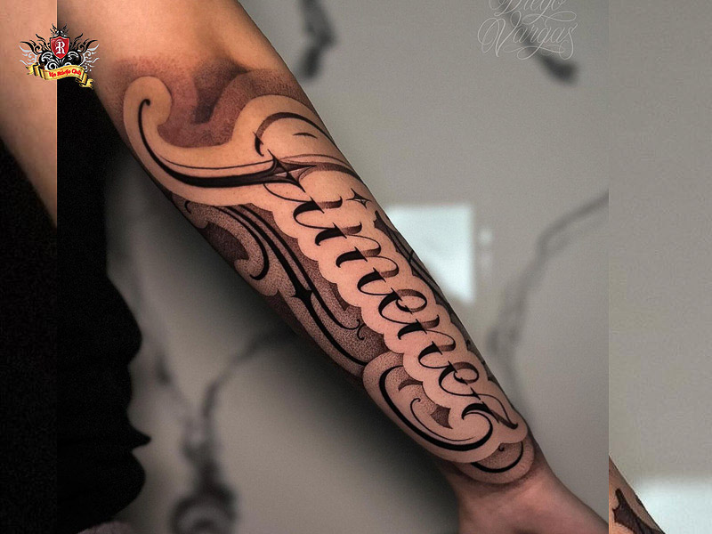 Sharp forearm chicano lettering tattoo design.