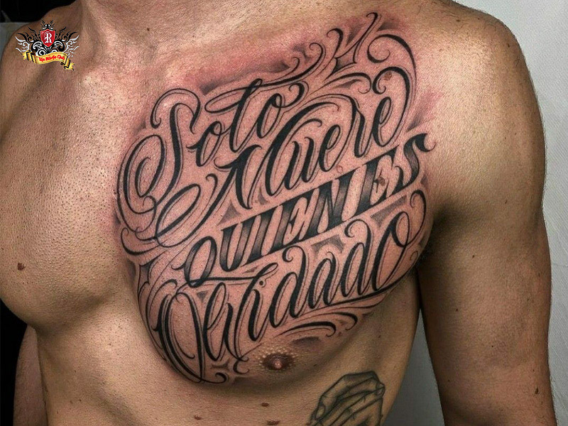 Large curved chest chicano lettering tattoo design.
