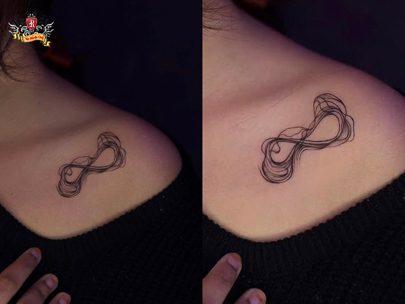 Hidden infinity tattoo behind ear and on collarbone.