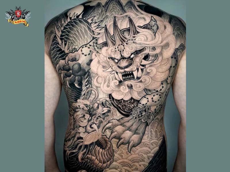 Grand full back piece foo dragon tattoo with sharp intricate details inked at Rio Tattoo Studio.