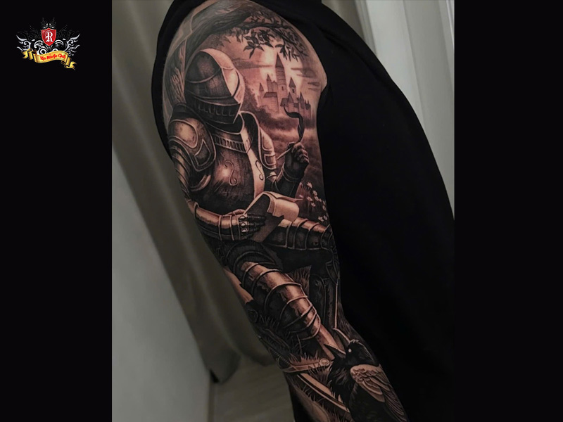 Close-up of a full sleeve knight tattoo showing the complete layout on an arm at Rio Tattoo Studio.