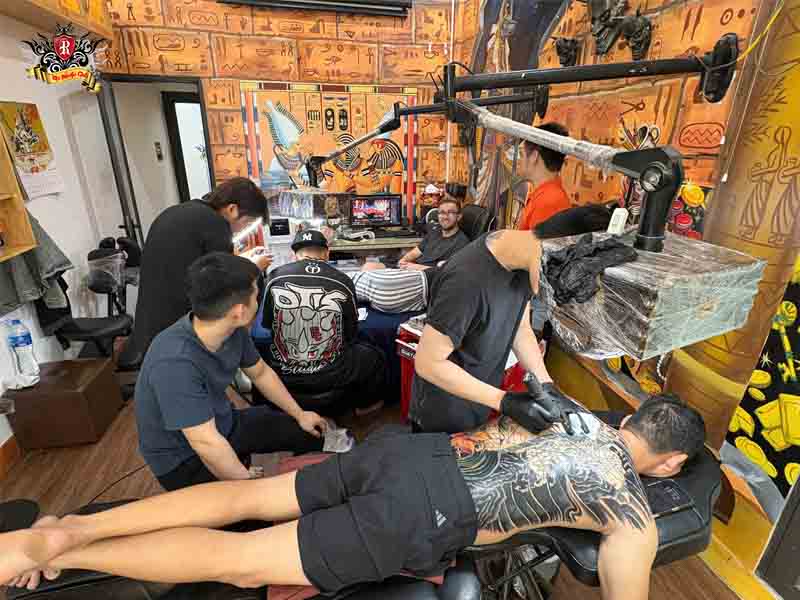 Rio Tattoo Studio artists working in a sterile medical-grade space to design custom spiritual tattoos.