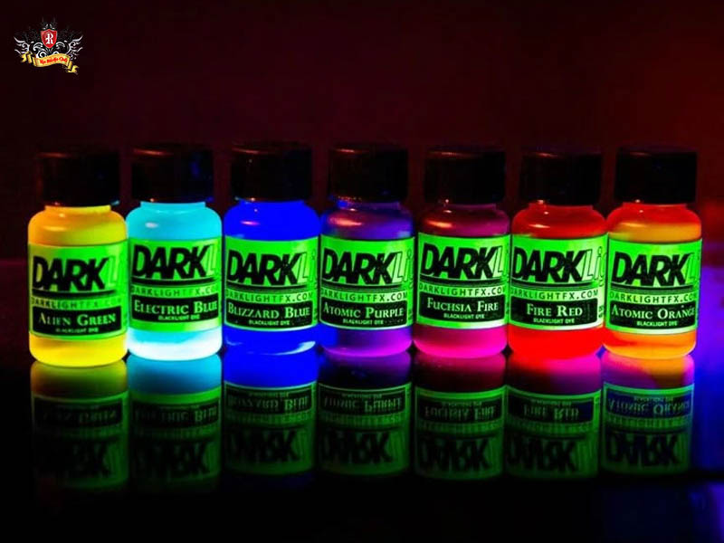 Premium imported ink bottles influencing uv tattoo pricing next to sterile medical kits at Rio Tattoo Studio.